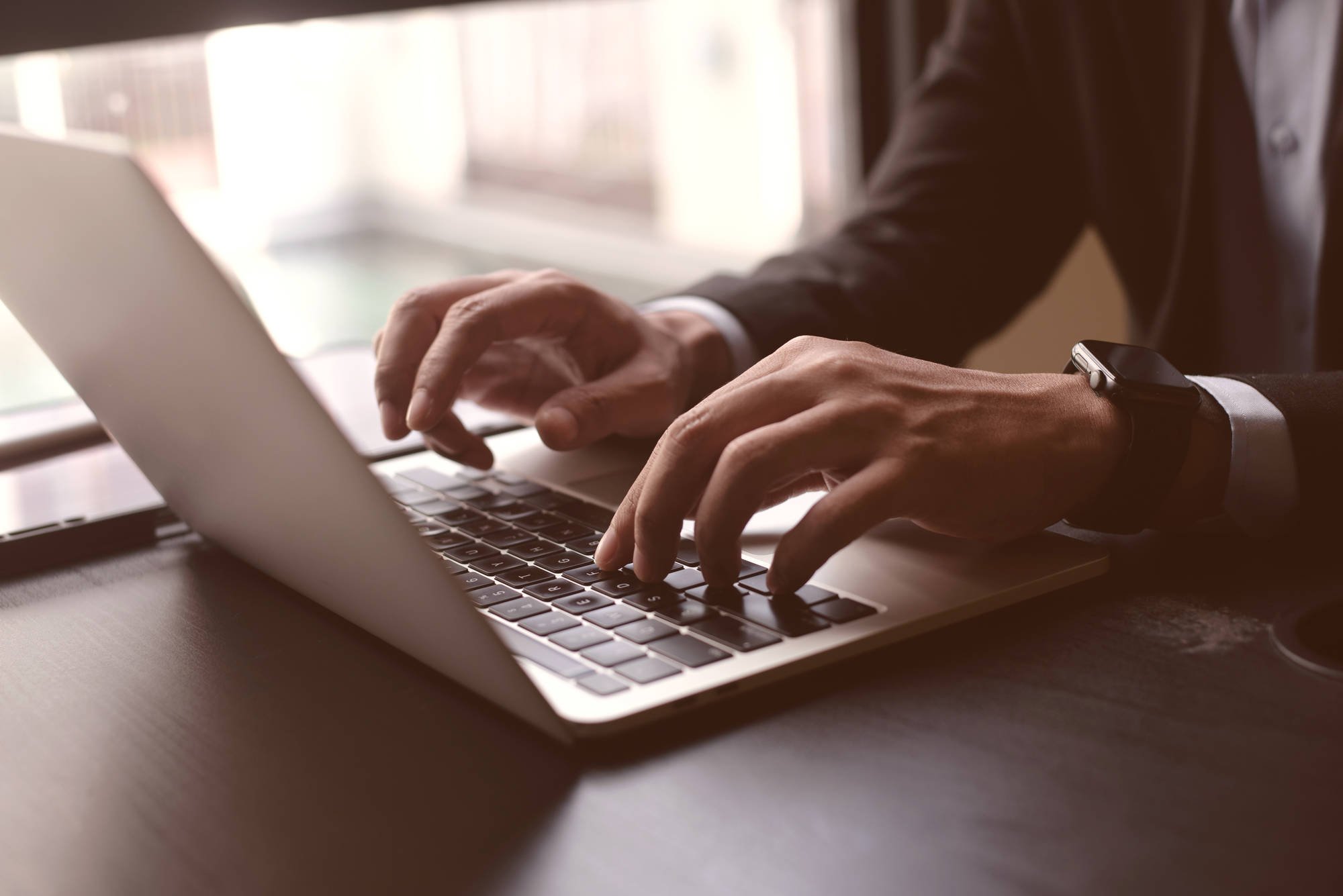 man typing on the keyboard